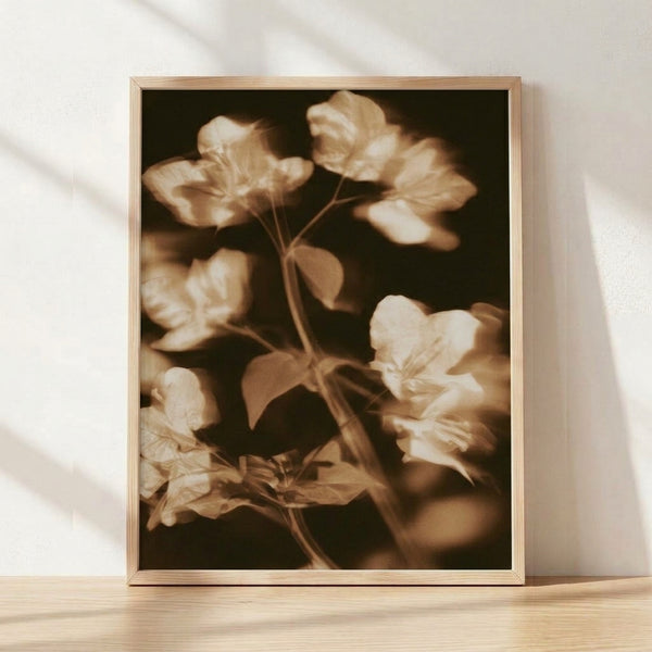 Sepia-toned vintage botanical print featuring a delicate flower with soft, impressionistic brushwork in cream and warm brown tones, evoking nostalgic 1930s charm.