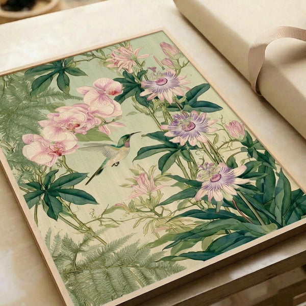 Framed botanical wall art depicting an ethereal hummingbird amid delicate orchid blossoms and garden foliage in impressionist style with cream, dusty pink, and muted green palette.