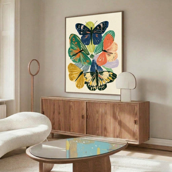 Framed nature-inspired wall art showcasing delicate butterflies among botanical elements in vintage style, featuring soft coral, golden yellow, forest green, and navy blue on a cream ground.