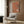 Tranquil vintage poster blending cats, botanical elements, and architectural details in soft sage green and cream tones, capturing the serene elegance of classical East Asian scroll art.