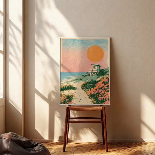 Nostalgic seaside poster with a warm golden sunset, iconic lifeguard tower, sandy pathway through beach grasses and flowering plants in soft coral, cream, and blue tones.