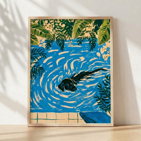 Vintage-style framed poster art depicting a joyful black Labrador swimming in a cobalt blue pool surrounded by olive green ferns and botanical leaves in art nouveau style.