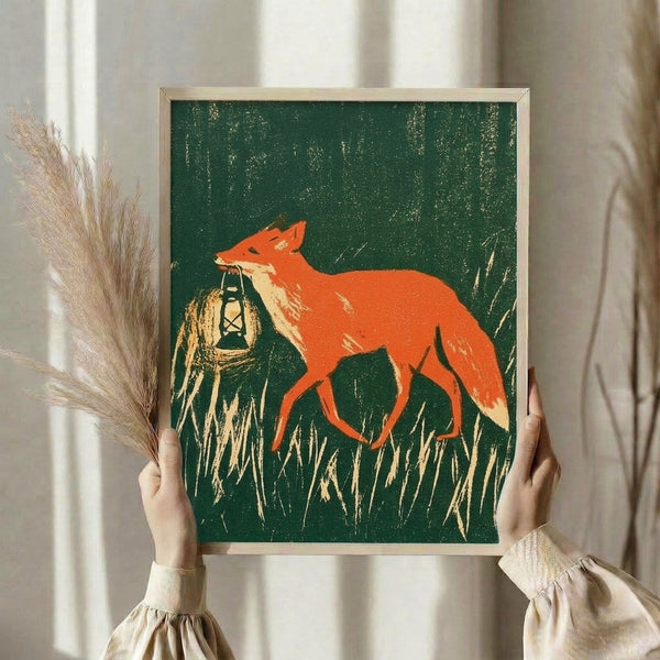Retro folk art framed print of a fox with lantern standing in a grassy landscape, rendered in muted forest greens and burnt orange hues with a whimsical yet nostalgic rustic charm.