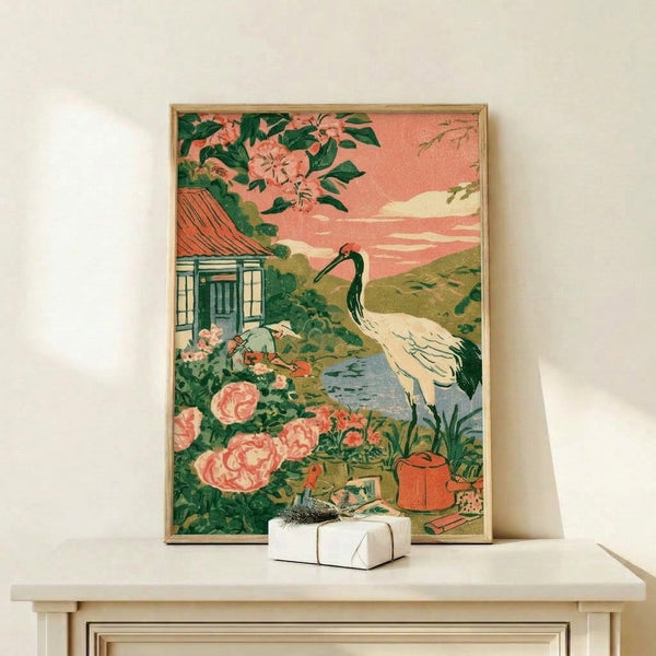 Art Nouveau-style framed print depicting a peaceful garden cottage at sunset with a crane among flowers and a watering can, in muted sage green and coral pink hues.