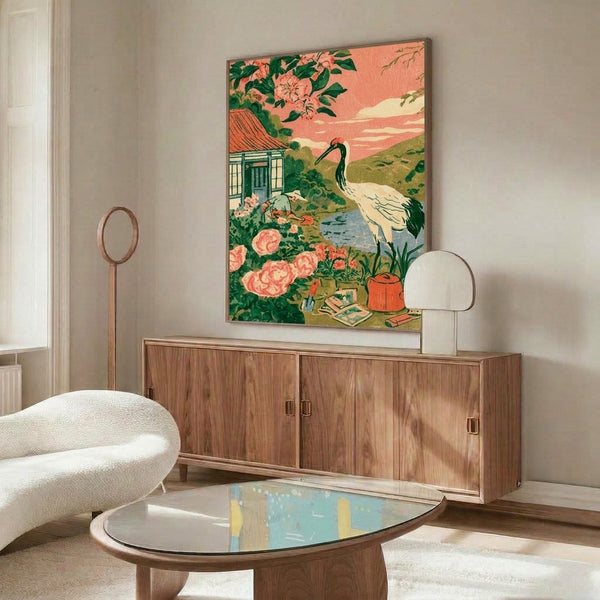 Framed poster blending Japanese and Scandinavian aesthetics: a serene cottage garden at dusk with a crane, flowering plants, and water, in soft coral, green, and cream tones.