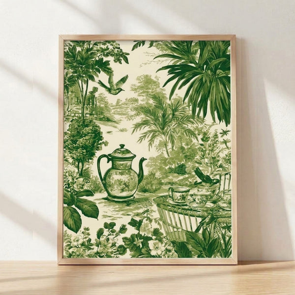 Framed vintage toile print featuring a serene garden scene with a teapot, teacup, flowering plants, and a bird among botanical elements in forest and sage green tones on cream background.
