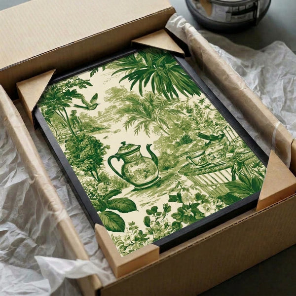 Vintage-style botanical print featuring an intimate garden vignette with teapot, teacup, flowering plants, and bird amidst palm fronds in muted sage and cream tones, hung as framed wall art.