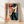 Vintage Bauhaus-style poster of a silhouetted jazz trumpeter in cream, red, and navy blue, evoking sophisticated 1920s cabaret aesthetics framed on a wall.