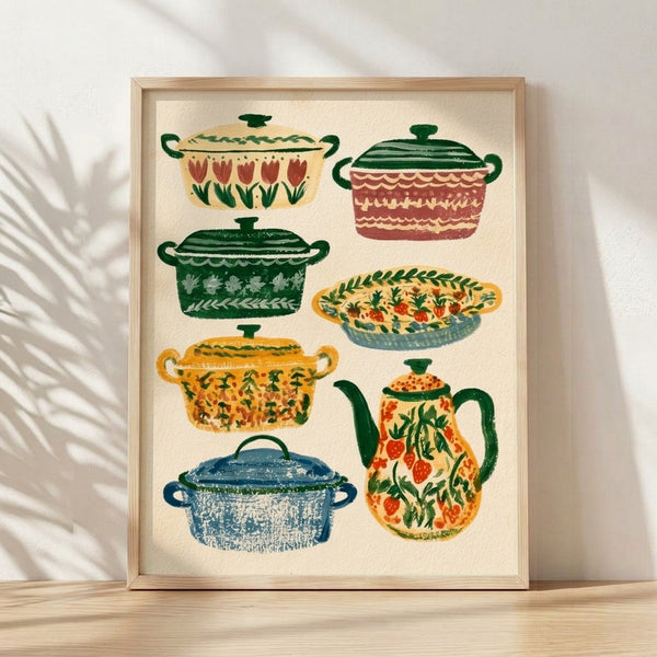 Vintage folk art poster featuring hand-drawn ceramic pots, pitchers, and kettles in cream, forest green, and terracotta tones, accented with cheerful strawberries and tulips; framed on wall.