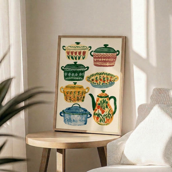 Cozy domestic folk art print showcasing vintage pottery and ceramic vessels arranged with strawberry and tulip motifs in earthy cream, green, and red hues; framed wall decor.