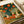 Nostalgic cottagecore wall art portraying enchanting rabbits at a lantern festival amid flowering gardens and woven baskets, rendered in a soft vintage palette of cream, sage, burnt orange, and teal with golden accents.