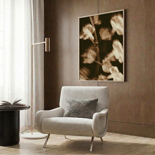 Framed vintage botanical wall art rendered in soft sepia and cream watercolors, featuring delicate flowers and stems that evoke a nostalgic, dreamy cottagecore aesthetic.