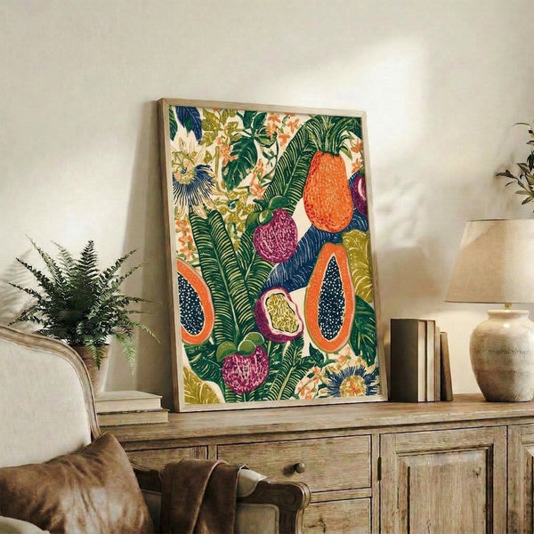 Boho-style tropical fruit botanical artwork displaying vibrant papayas and passion fruits surrounded by ornamental foliage in ochre, navy blue, and cream, presented as a framed wall art print.