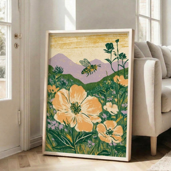 Framed botanical art print featuring a bee among blooming wildflowers and mountain backdrop, styled in retro vintage aesthetics with a gentle palette of muted creams, golds, greens, and lavender hues.