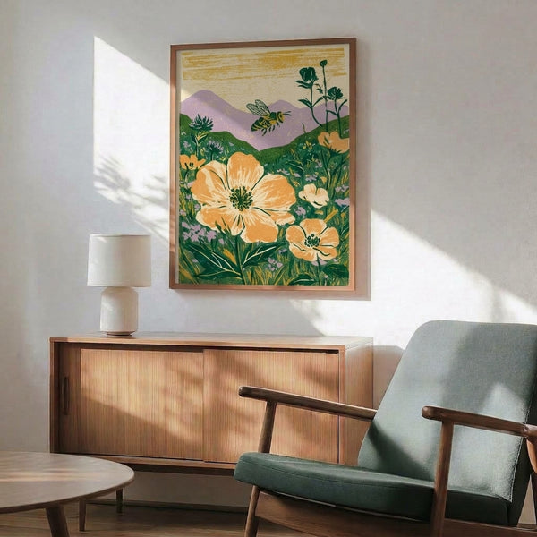Retro farmhouse wall print depicting a bee nestled in wildflowers with rolling mountains beyond, rendered in peaceful vintage tones of cream, gold, forest green, and gentle lavender with warm accents.