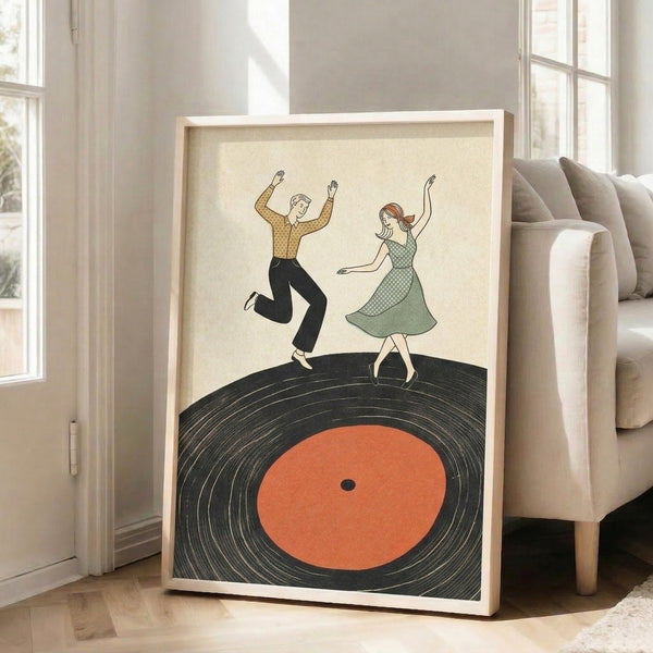 Playful vintage-style wall art showing a dancing couple with a record player motif in cream, black, and orange tones, capturing retro joy and movement.