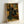 Framed art print depicting an elegantly dressed woman gazing at paintings in an interior gallery space, impressionist style with cultured, serene atmosphere in cream and ochre hues.