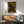 Impressionist-style framed artwork of a woman in a museum setting, rendered in warm cream and ochre tones with contemplative, sophisticated mood.