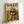 Sophisticated pop art poster of a chic Shih Tzu with sunglasses sipping champagne in a retro landscape scene, featuring glamorous cream and black tones with gold accents.