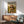 Pop art style poster of a glamorous sunglassed Shih Tzu enjoying champagne in a stylized landscape, combining retro charm with sophisticated humor in gold and cream hues.