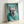 Framed poster art of a fashionable Dogue de Bordeaux adorned with jewels and a luxe fur stole, illustrated in contemporary pop art with turquoise, cream, and metallic accents.