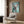 Whimsical pop art poster of a stylized French Bulldog in high-fashion attire with luxury accessories, depicted in a sophisticated palette of turquoise, cream, white, and rose gold tones.