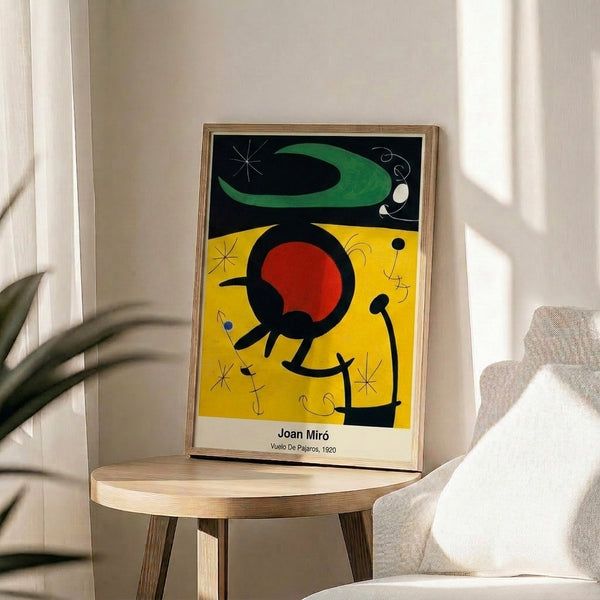 Framed poster of abstract modernist composition featuring stylized flying birds and biomorphic forms in vibrant primary red, blue, yellow, and black.