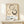 Modern framed poster displaying abstract brush strokes forming circles in taupe and charcoal, capturing the essence of wabi-sabi and meditative simplicity.