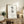 Serene black calligraphy on beige wall art, minimalist Japanese characters creating a tranquil Zen garden atmosphere.