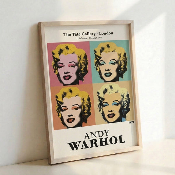 Framed pop art print of Marilyn Monroe's face in celebratory hot pink and mint green, rendered in bold Warhol-inspired style.