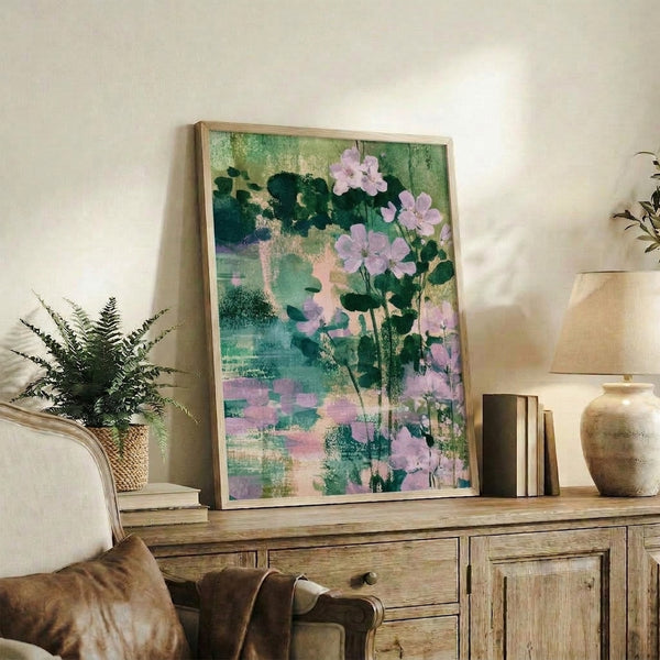 Botanical watercolor artwork with geraniums and layered foliage in calming lavender, sage green, and cream palette, creating tranquil garden atmosphere as a wall-mounted print.