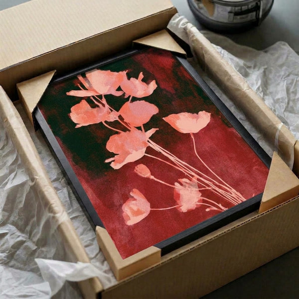 Contemplative botanical watercolor print of poppies in romantic coral and crimson hues with dark green leaves, displayed as framed wall art.