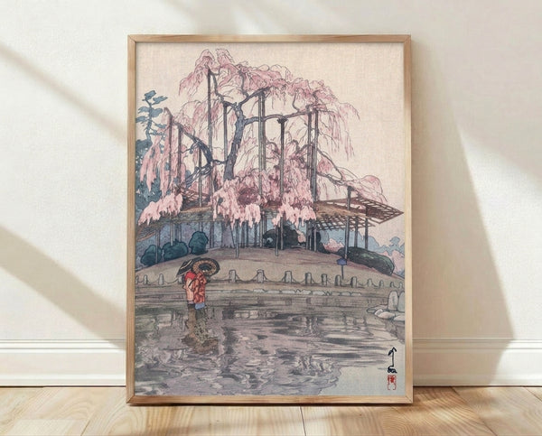 Japanese woodblock print featuring a weeping willow tree overlooking a serene garden pond, with a solitary figure holding an umbrella beneath the drooping branches in teal-blue, pink, and cream tones.