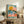 Retro-modern nature poster with a peaceful whale scene, blooming florals, and a radiant sun in warm golden and cool teal hues.