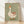 Whimsical retro folk art poster of a goose wearing a party hat surrounded by red and orange hearts, rendered in sage green, cream, and warm earth tones.