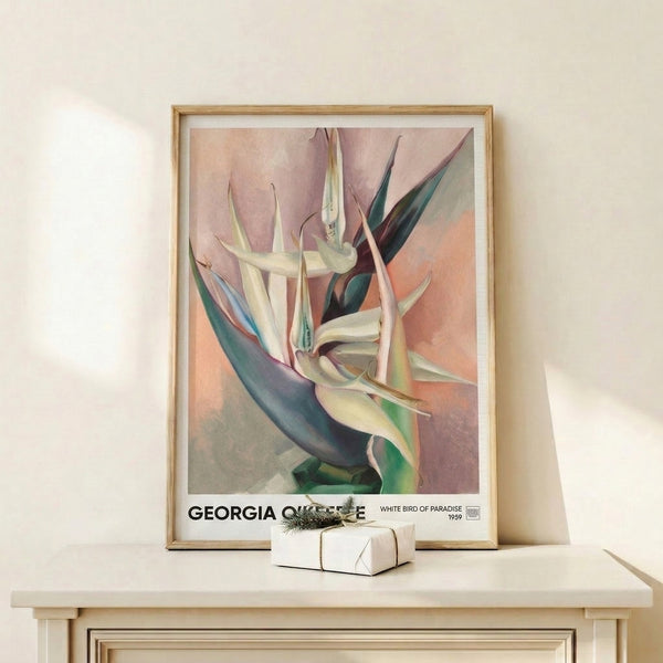 Framed watercolor art print showcasing the sensual curves of a white bird of paradise flower rendered in cream, rose, and cool teal hues on gallery-style display.