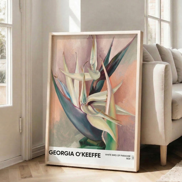 Elegant watercolor poster of a bird of paradise bloom with soft cream and dusty rose petals accented by sage and teal tones, matted and hung as refined wall art.