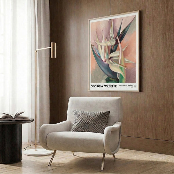 Soft watercolor art print of a white bird of paradise rendered in cream, dusty rose, sage, and teal—a sensual, contemplative floral composition in a wall-mounted frame.