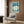 Contemporary wall art featuring softly rendered flower shapes in deep blue and sage green, creating a sensual, contemplative composition that celebrates the subtle forms of nature.