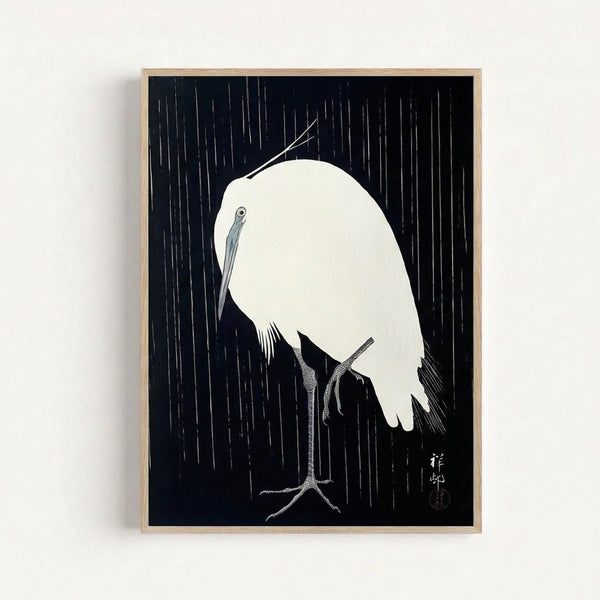 Serene line art poster of a crane in rain with contemplative mood, inspired by traditional woodblock print techniques, displayed as framed wall art in muted blue and white tones.