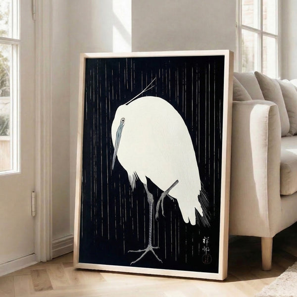 Japanese-inspired woodblock poster featuring a peaceful crane amid rainfall, rendered in elegant minimalist line art with navy, gray, and white color scheme.