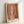 Framed mid-century modern art print showing an organic composition of white and gold feather forms against warm tan and cream backgrounds.