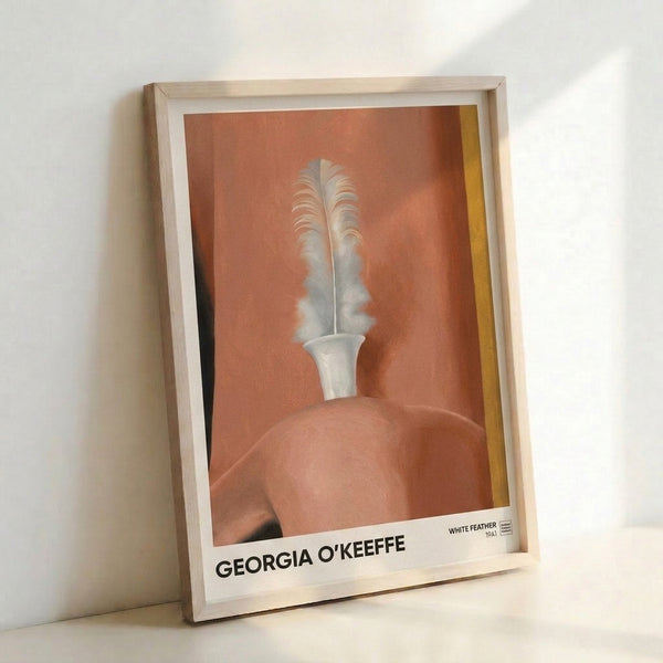 Framed mid-century modern art print showing an organic composition of white and gold feather forms against warm tan and cream backgrounds.