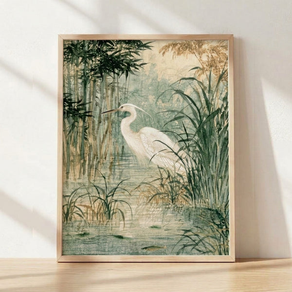 Serene watercolor painting of a white heron standing among soft green bamboo reeds and marsh grasses in muted sage and pale blue tones, framed as wall art.
