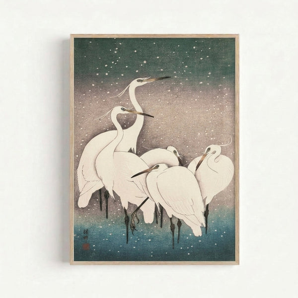 Minimalist Japandi poster depicting graceful cranes in winter snow, featuring a contemplative composition in muted whites, greens, and cool blue hues on a gallery wall.