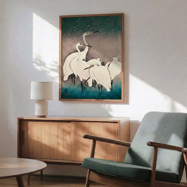 Contemplative Japandi wall art showing white herons resting in snow, combining traditional woodblock aesthetics with serene palette of cool whites, blues, and sage greens.