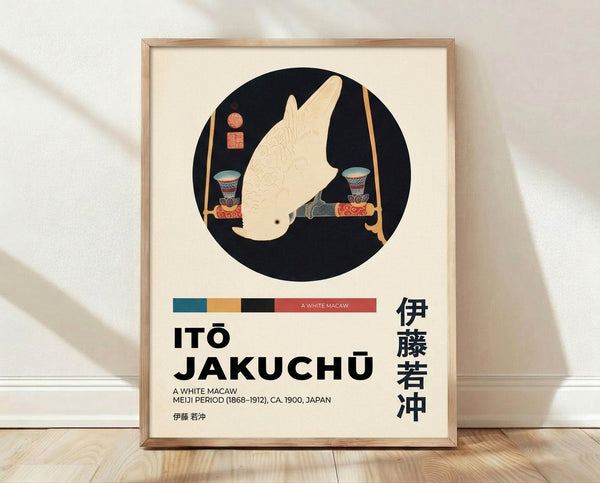 Framed Japanese woodblock print of a white macaw perched near a decorative vase, rendered in refined black ink with teal and gold accents on cream background.
