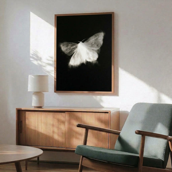 Minimalist poster displaying a refined moth illustration with thin, flowing lines in monochromatic tones, creating a delicate and tranquil focal point.