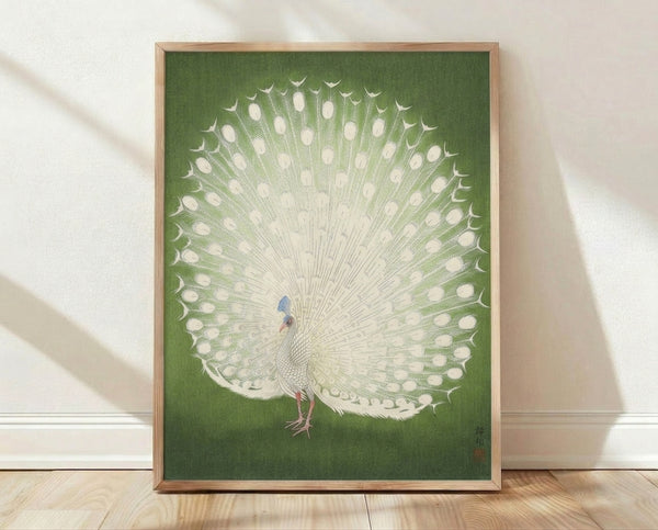 Serene white peacock woodblock print in sage green and cream tones, displaying minimalist Japanese aesthetic on a framed wall art piece.