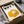 Minimalist wall print featuring a simple yet striking fried egg motif in golden yellow with witty text elements in a contemporary style.